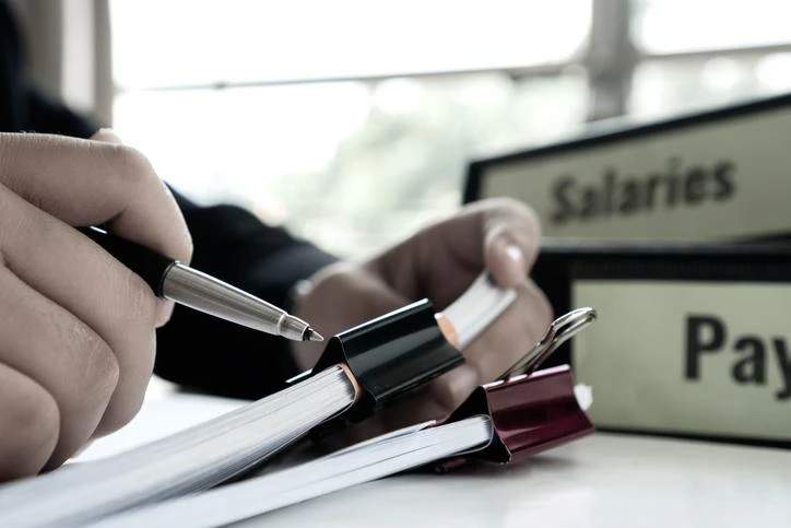 An HR administrator working on paperwork.