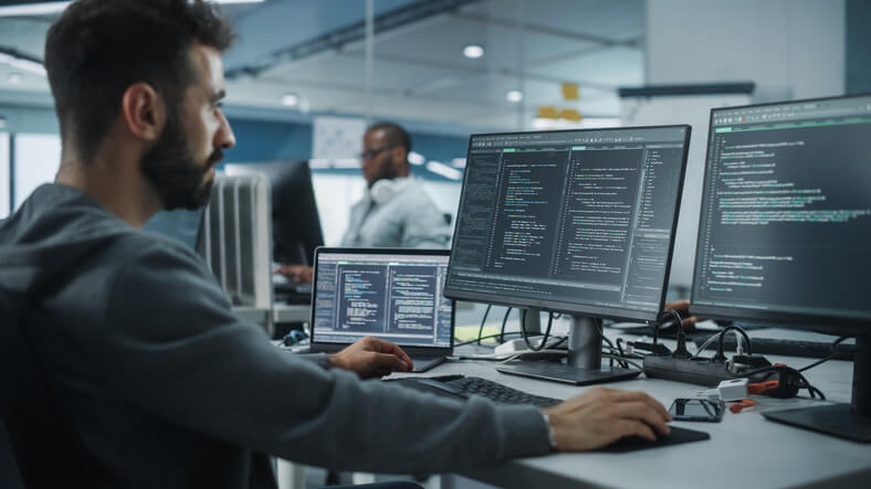 An IT professional working on a computer after corporate training