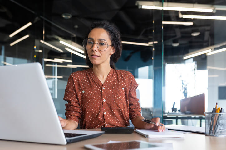 An HR manager working on a computer after business administration training
