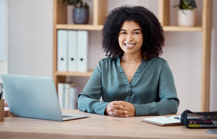A legal assistant working at a desk.