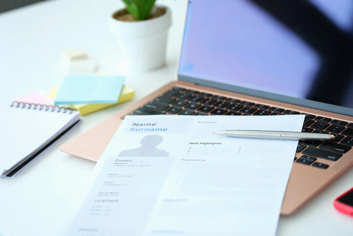 A resume on a laptop.