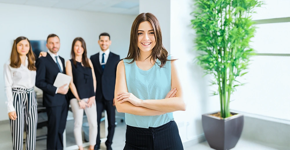 An administrative assistant using office software for document preparation at work.