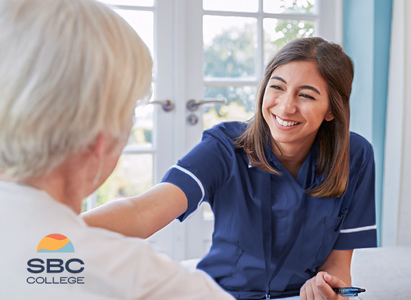 A home support worker comforting a senior during a home visit.