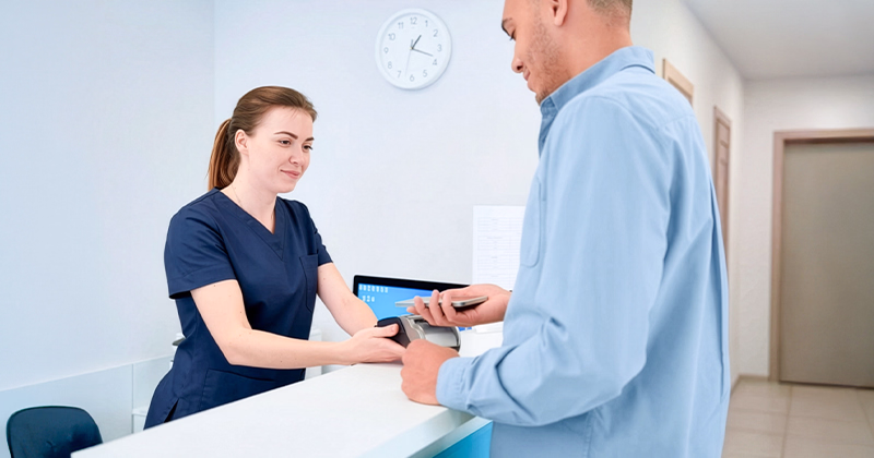 A medical office assistant working in a professional work setting.