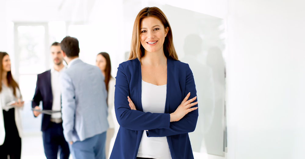 A group of people with business careers in a team photo.